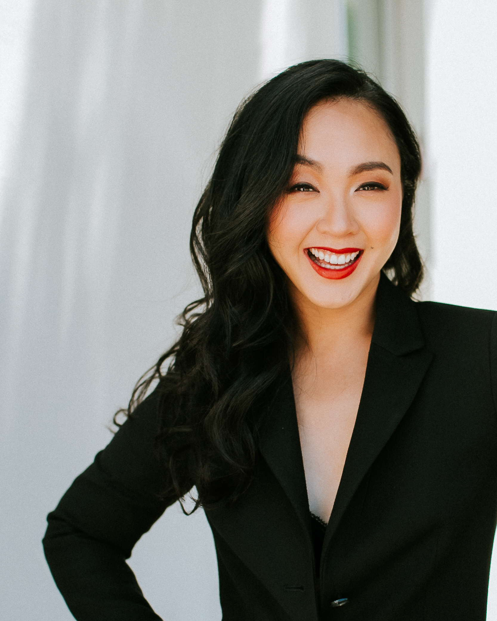 Photo of Beverly Bautista, An Asian women with black hair and wearing a black dress.