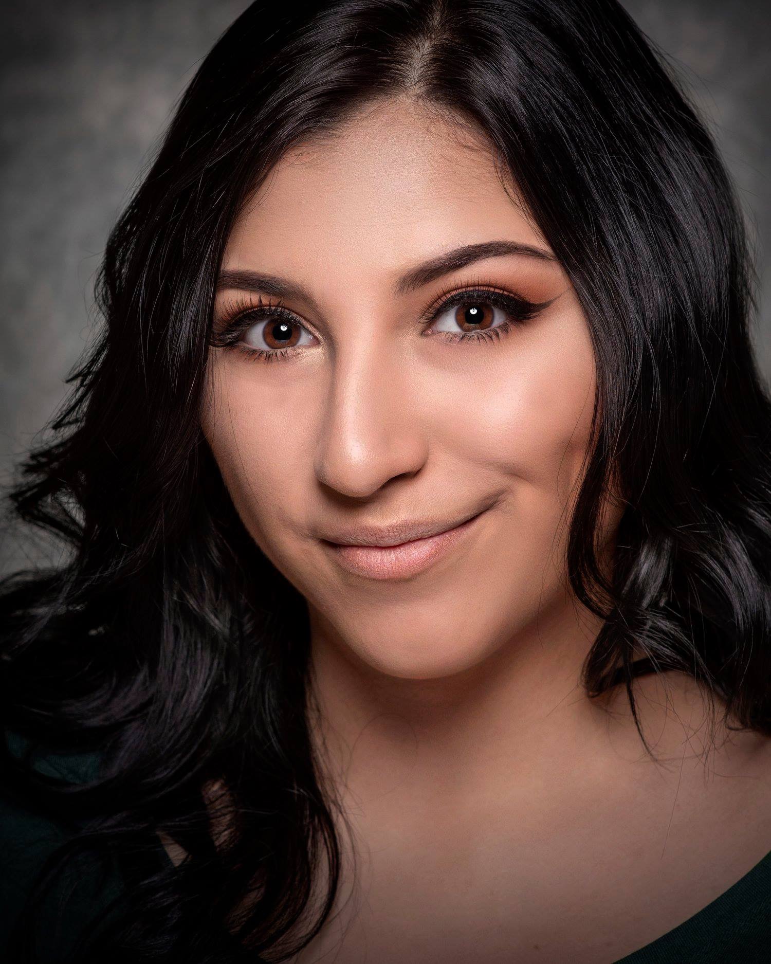 Photo of Juliana Silva. A Latinx women with long black hair.