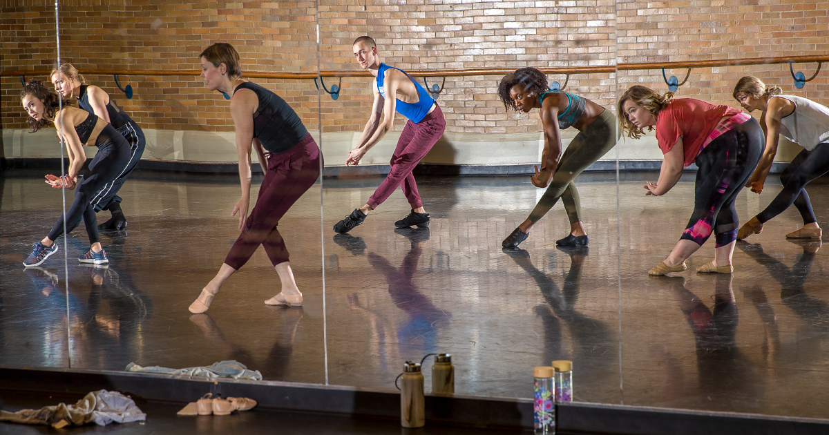 Several students dancing in a class.