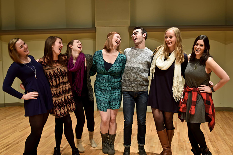students pose inside a dance studio