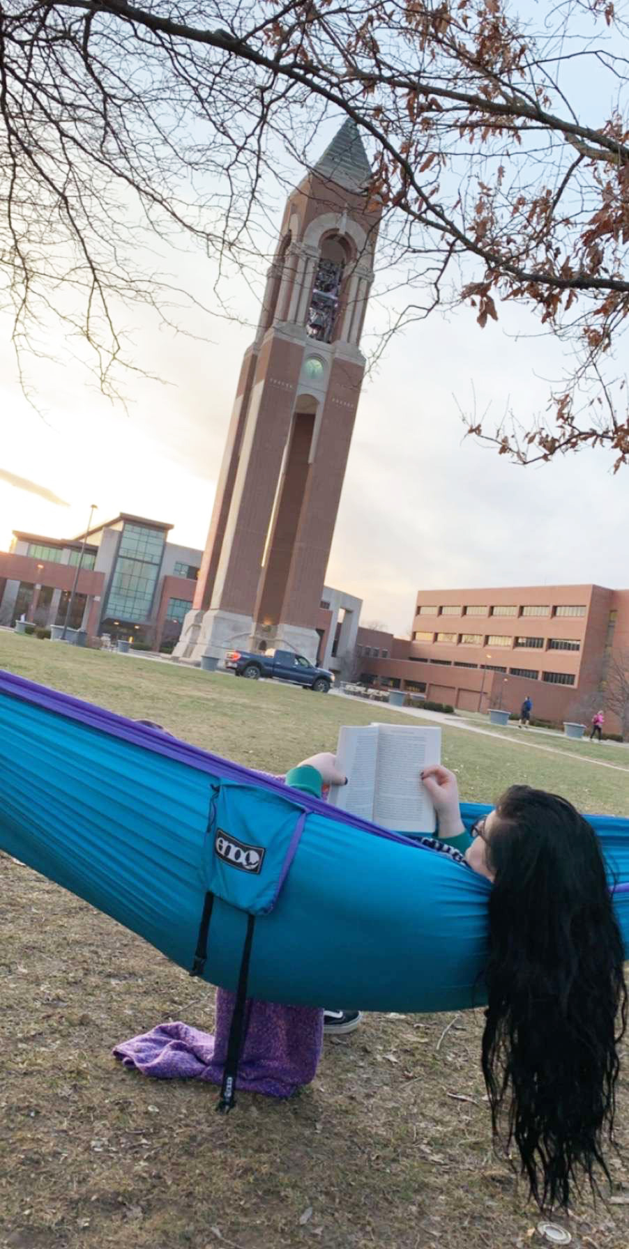 Sophia Lyons reading in a hammock