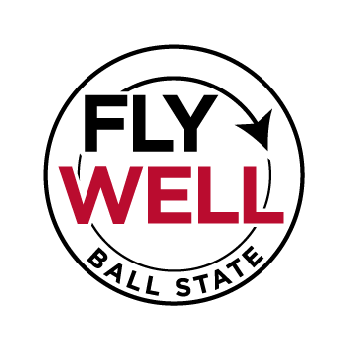 Fly Well Ball State logo black red circle with airplane path text FLY WELL BALL STATE 