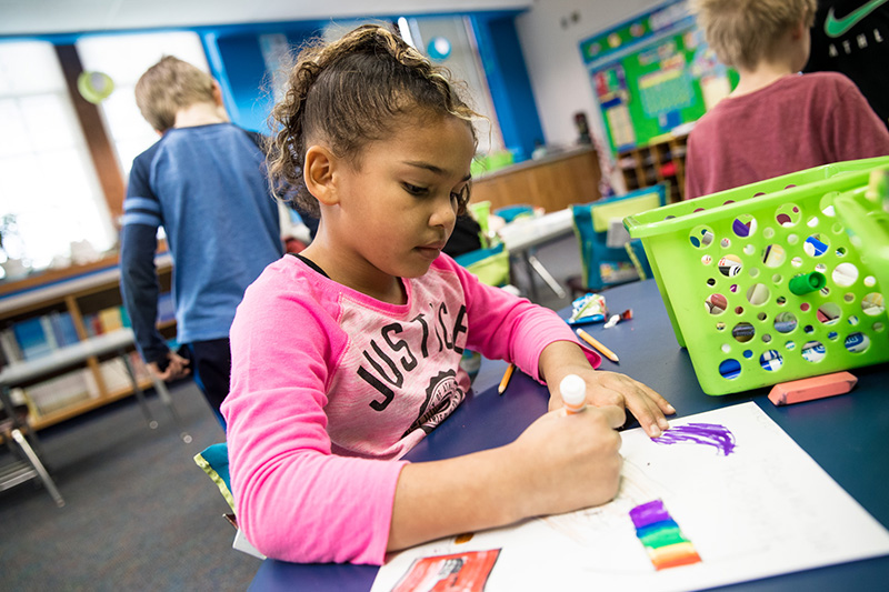 Child working on project in classroom