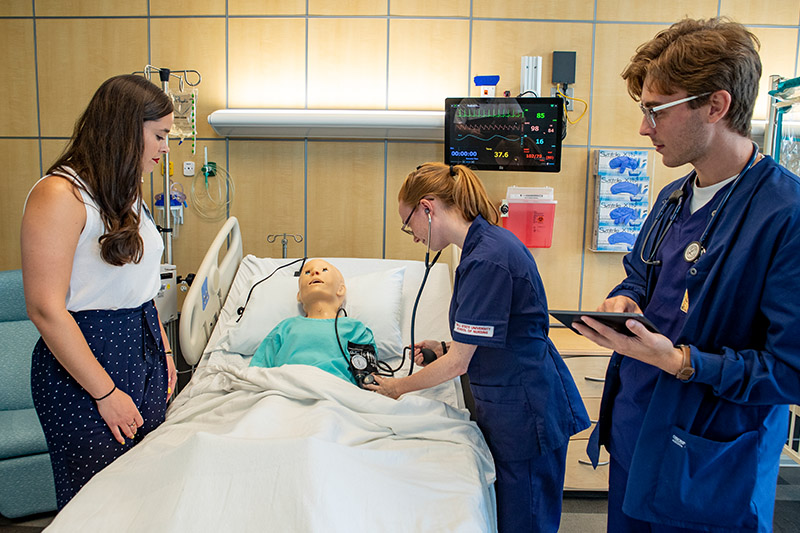 Nursing students work together in the Pediatric Simulation Lab