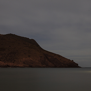 the shore of an island on a cloudy day