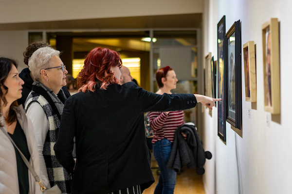 patrons viewing the 89th Annual Student Art Show