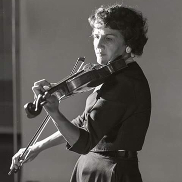 Black and white photo of Patricia Tretick playing the violin.