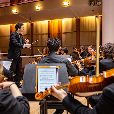 Ball state symphony orchestra rehearsing in Sursa Hall