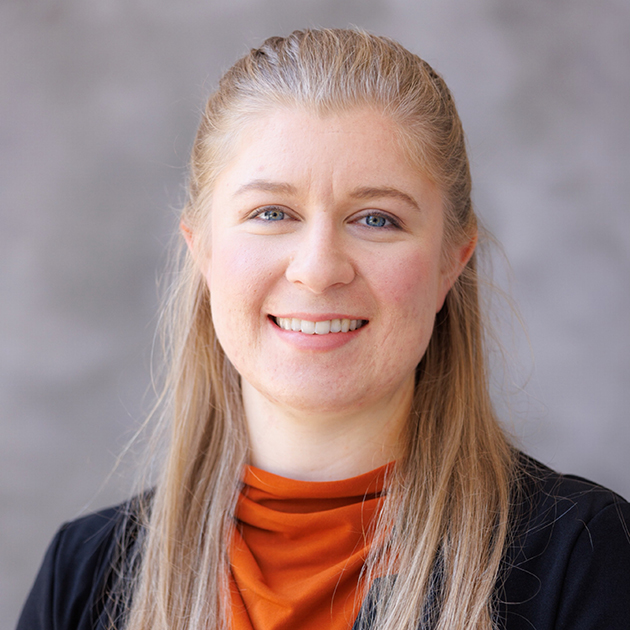 pianist Hannah Roberts photographed against a gray background