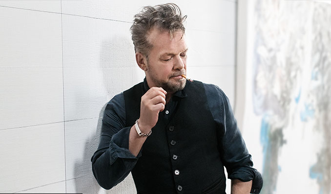 John Mellencamp wearing a black button-down shirt