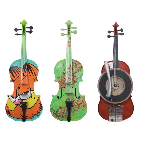 Fourteen artists have contributed hand-painted violins to be auctioned off benefiting Emens Auditorium, including local artists (left to right), Tom Howard, Patricia Kreigh and Nate Harmon