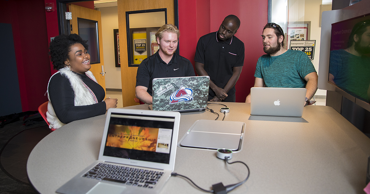 Students sit and collaborate in Entrepreneurship Center at Ball State University.