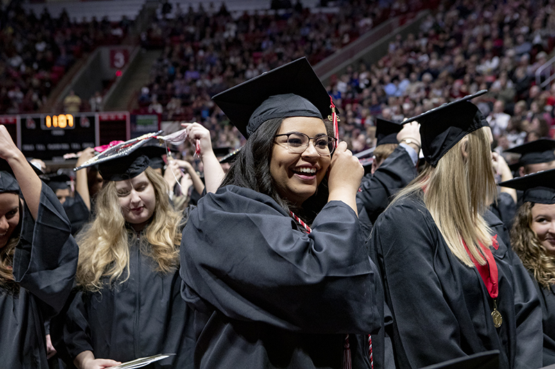 student turning tassels at Fall Commencement 2019