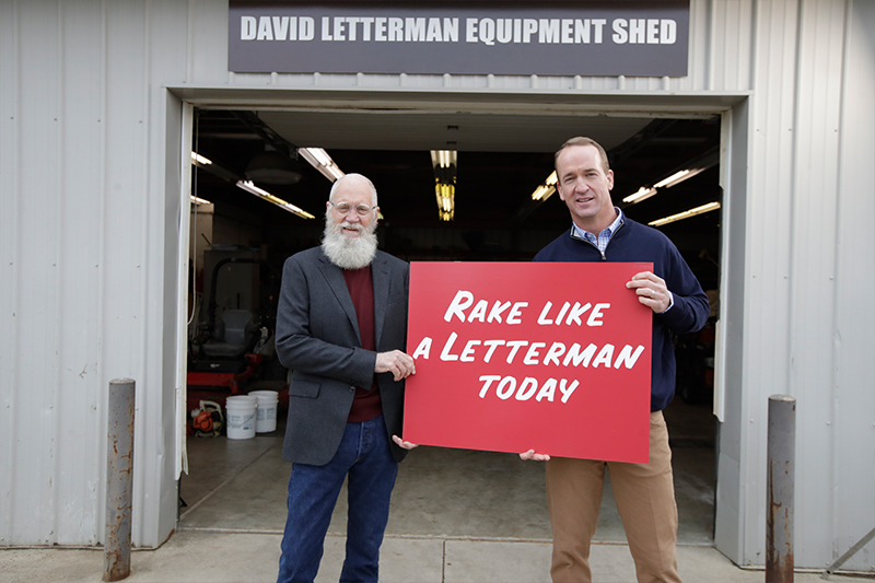 David Letterman and Payton Manning pose in front of the Letterman Equipment Shed