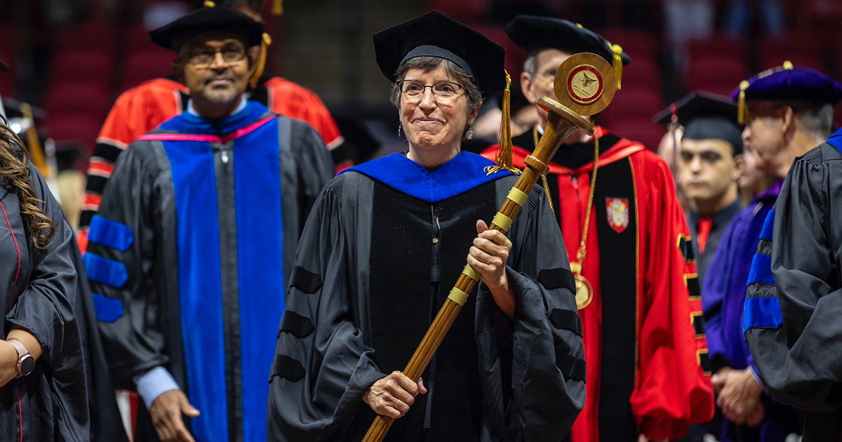 Ball State faculty and staff walking down the aisle at the 2024 summer commencement ceremony