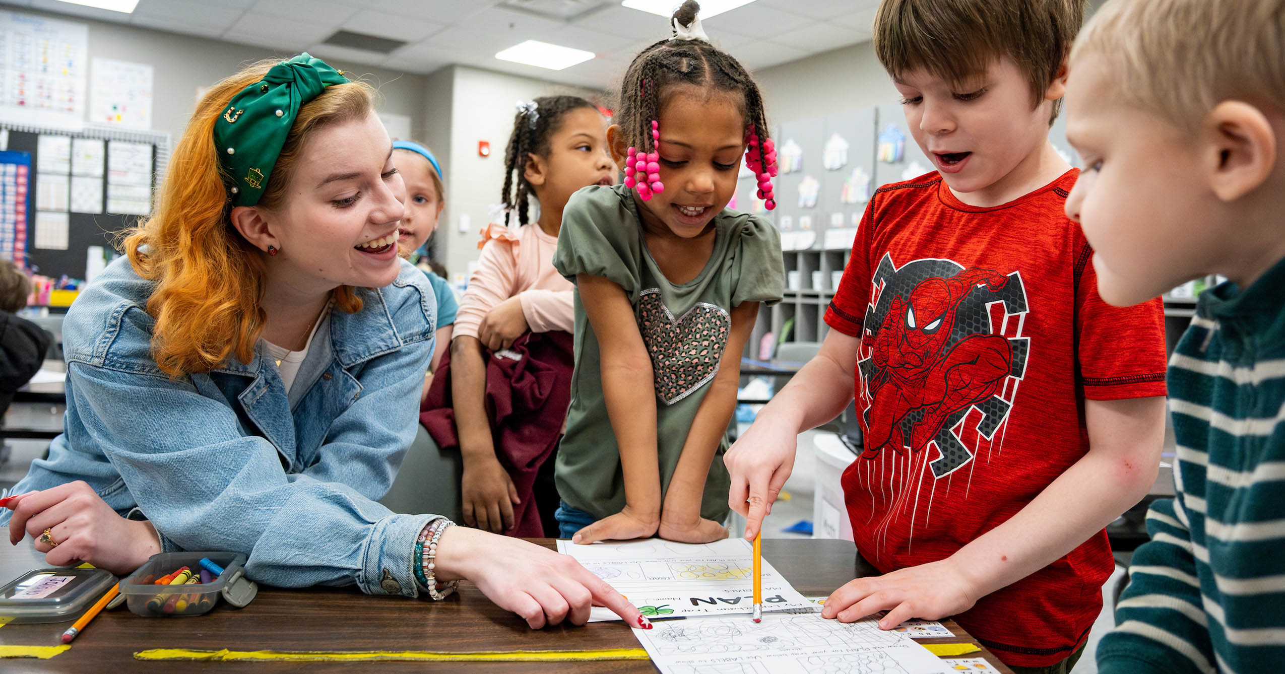 Ball State student teacher Lexi helps young students with a classroom activity at South View Elementary in Muncie, Indiana.
