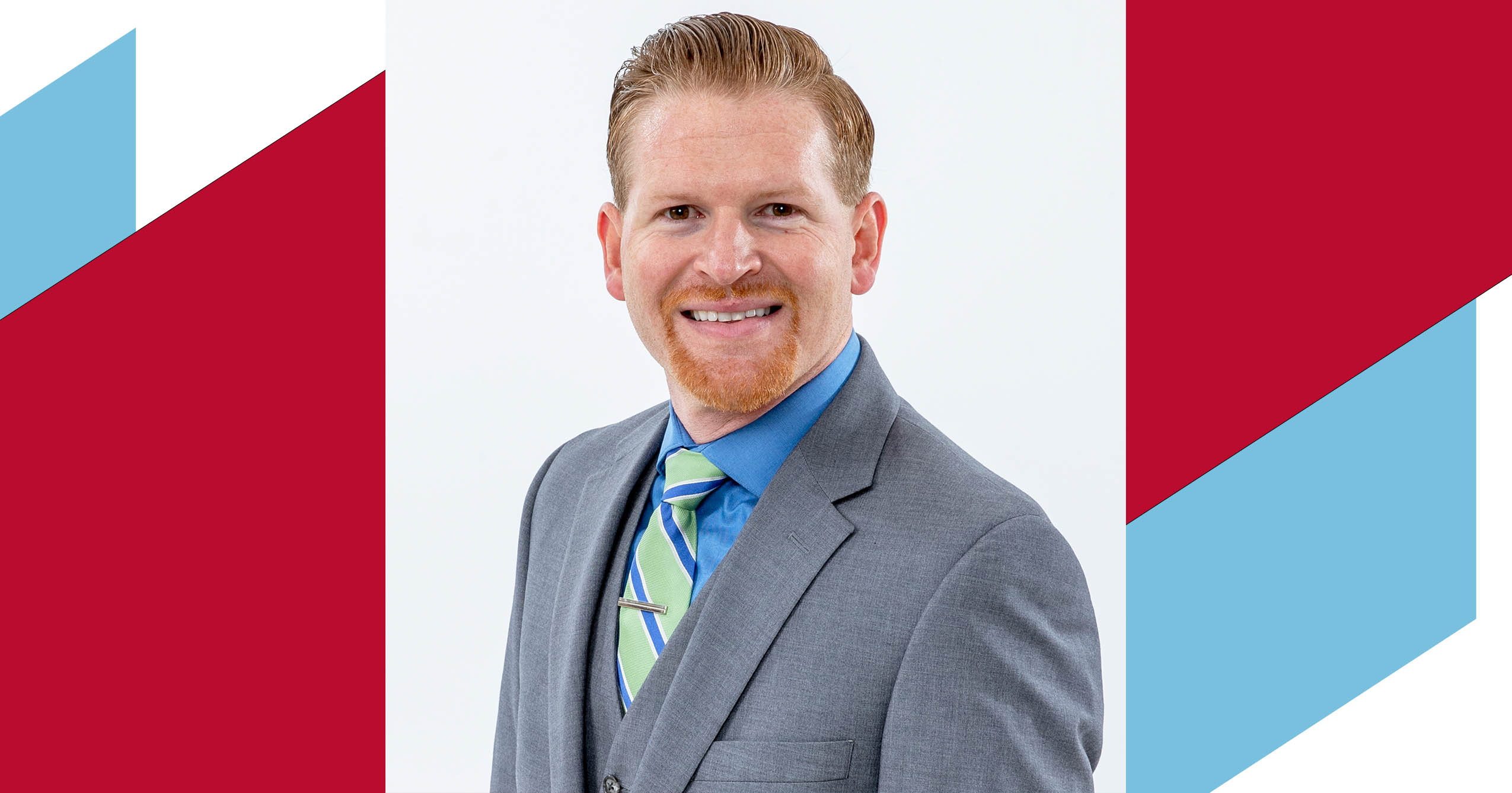 Dr. Adam Kuban poses for a professional headshot.