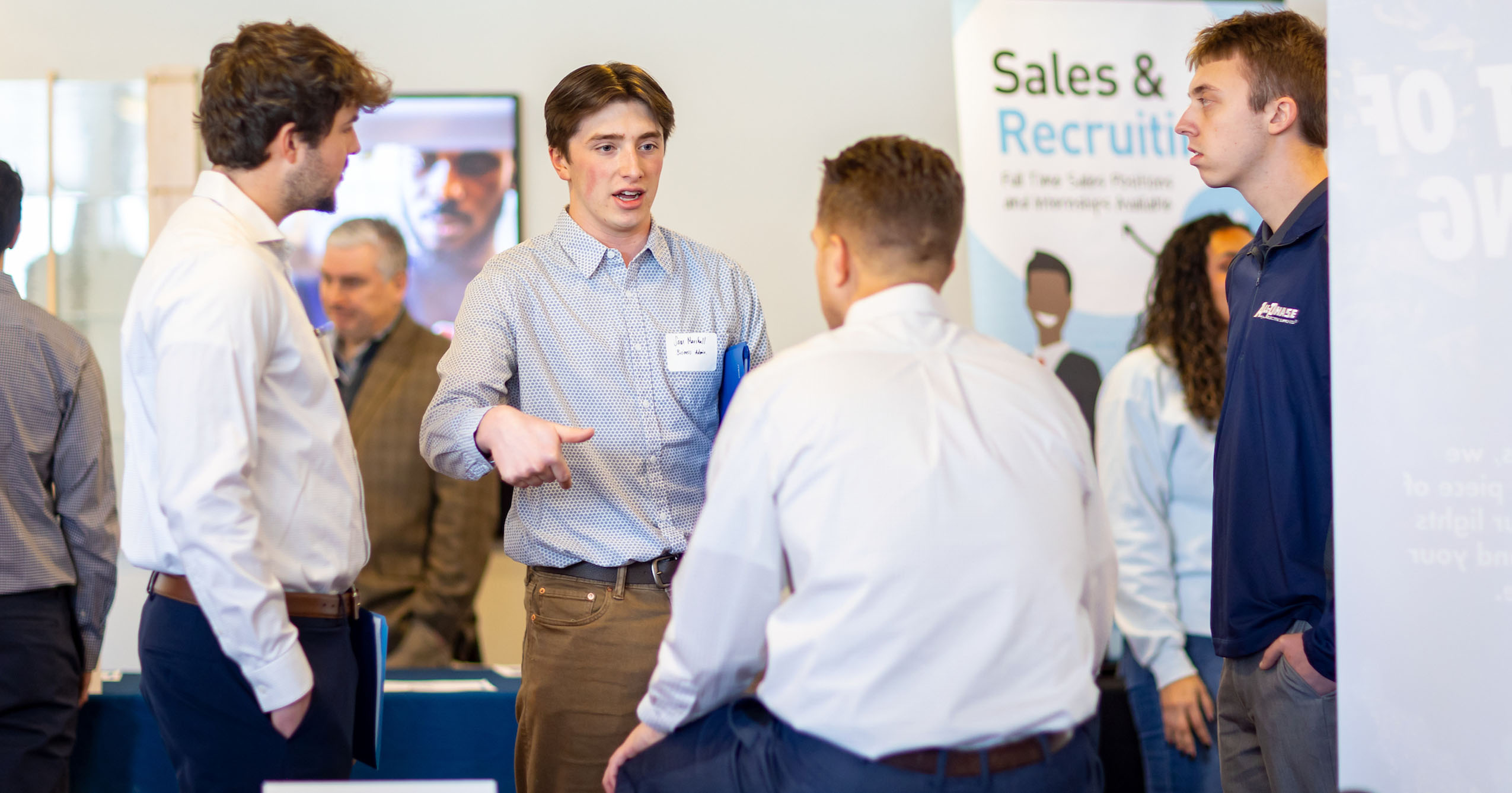 Several students talk with employers at Ball State’s 2025 Sales Career Fair.