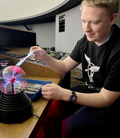 Aiden with plasma ball and spectrum tube